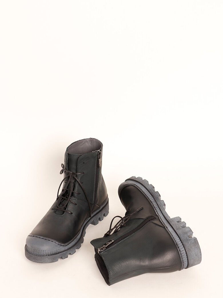 Boot with rubber sole and shoe lace
