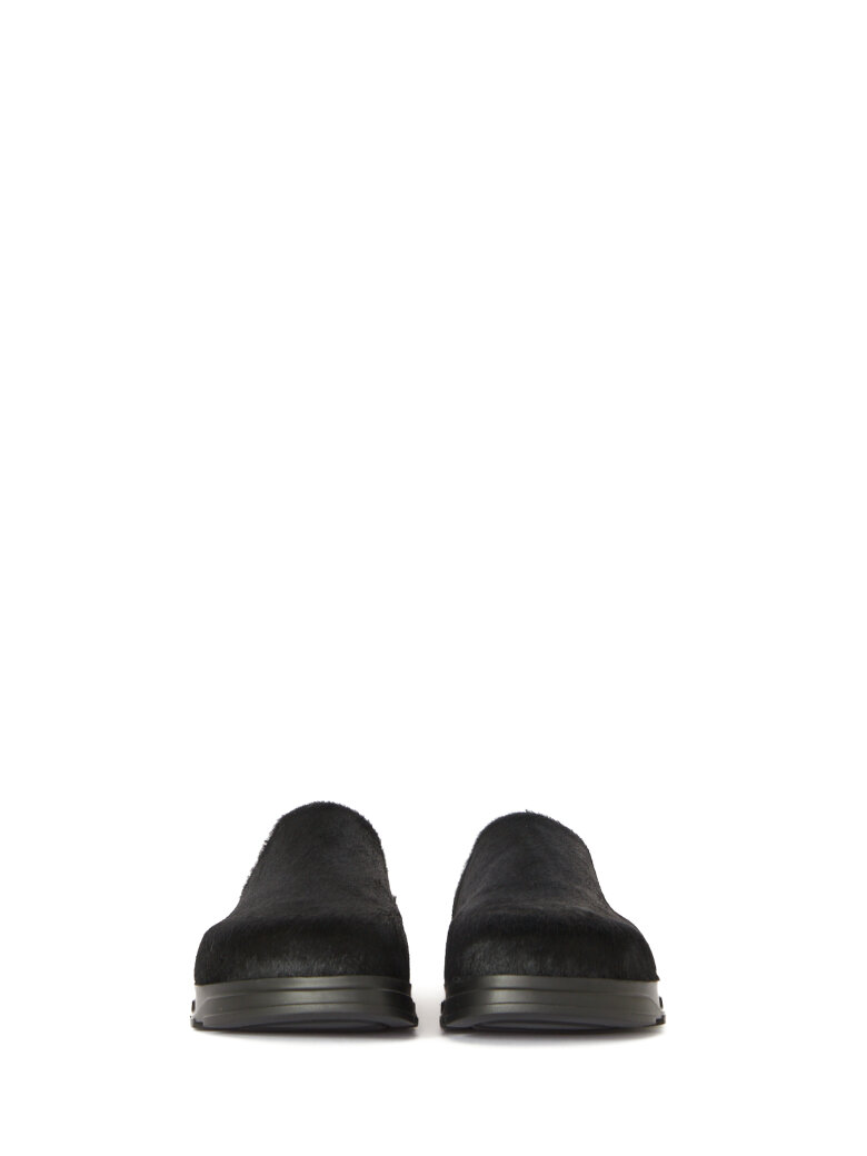 Lofina - Slippers in fur with a footbed sole